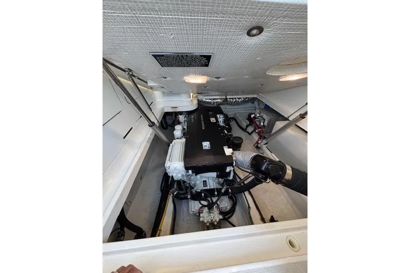 Slide: The Image of Engine compartment of a 2018 Back Cove 30 boat, showcasing mechanical components. - 46