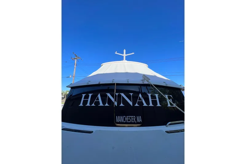 Slide: The Image of 2015 Back Cove 30 boat named "HANNAH E" in Manchester, MA, under clear blue sky. - 50