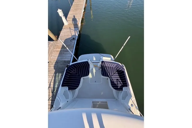 Slide: The Image of 2018 Back Cove 30 boat docked, aerial view of deck and seating area. - 8