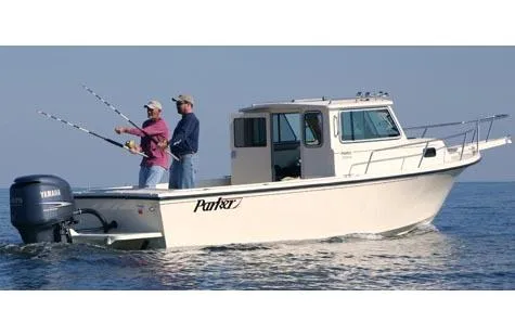 The Image of 2007 Parker 2320 SL Sport Cabin boat docked on calm water. - 0