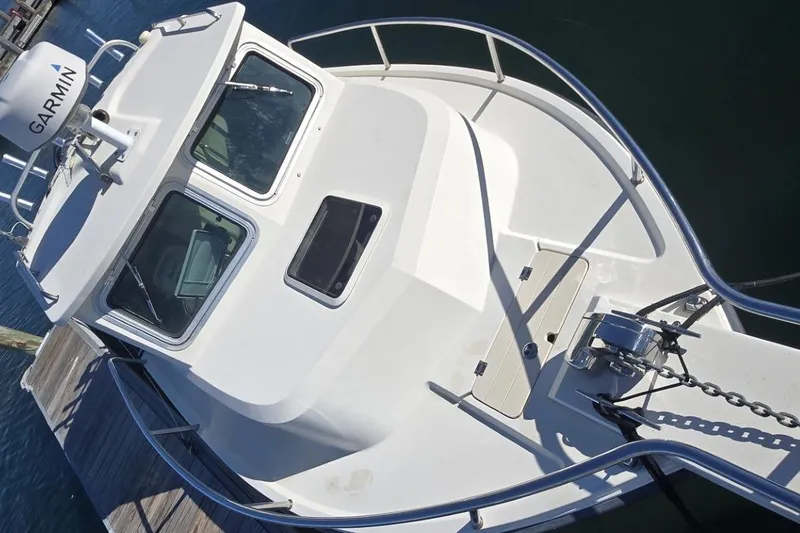 Slide: The Image of Spacious deck of 2007 Parker 2320 SL Sport Cabin boat, featuring clean, open layout. - 5