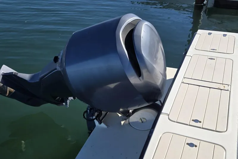 Slide: The Image of 2007 Parker 2320 SL Sport Cabin boat docked by serene waters. - 6