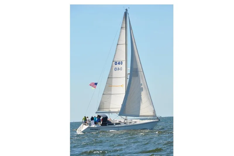 The Image of Sailing Catalina 42 yacht from 1989 on open water, American flag flying. - 0