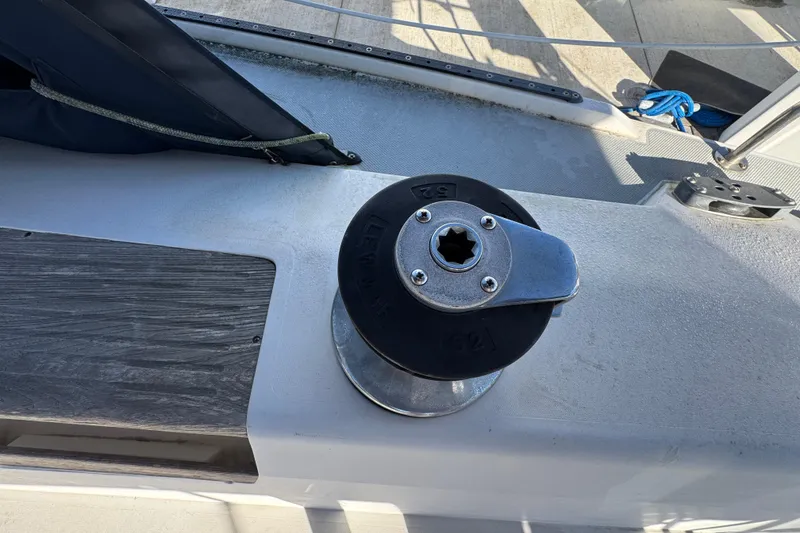 Slide: The Image of Winch on 1989 Catalina 42 sailboat deck, featuring Lewmar 52 model. - 11
