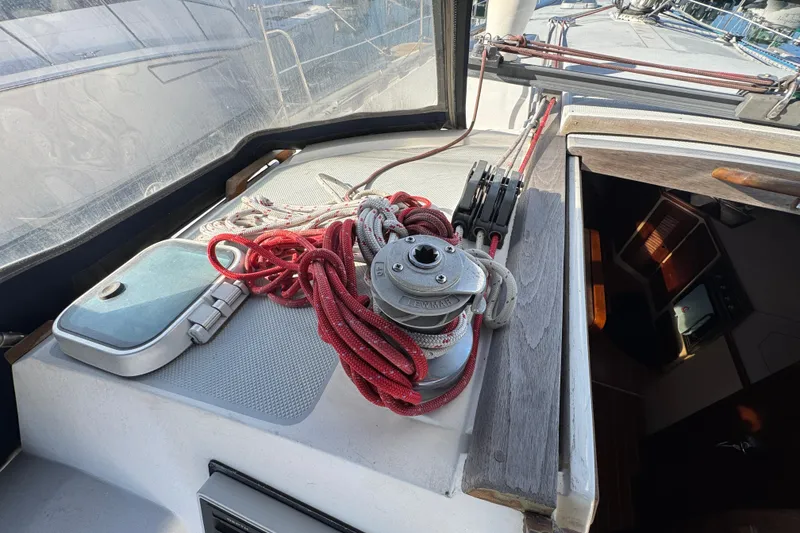 Slide: The Image of Cockpit of 1989 Catalina 42 sailboat with winch and red ropes. - 12