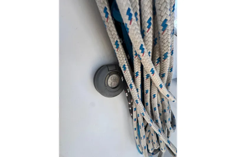 Slide: The Image of Close-up of Catalina 42 sailboat ropes, 1989 model, with a deck fitting. - 15