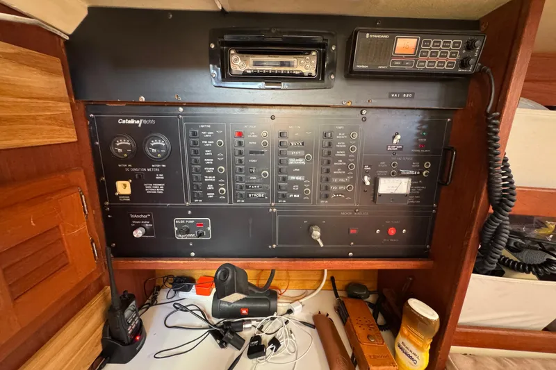 Slide: The Image of Electrical control panel of a 1989 Catalina 42 yacht with various switches and meters. - 22