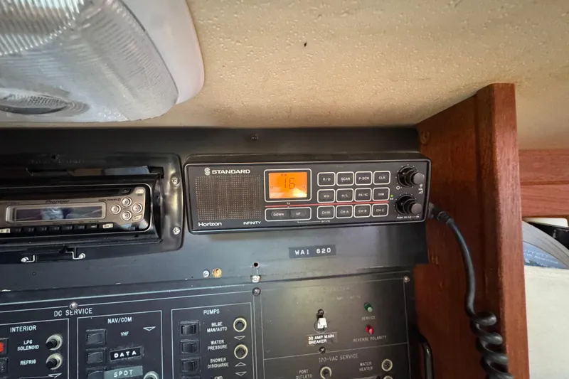 Slide: The Image of Control panel of a 1989 Catalina 42 sailboat with radio and navigation equipment. - 23