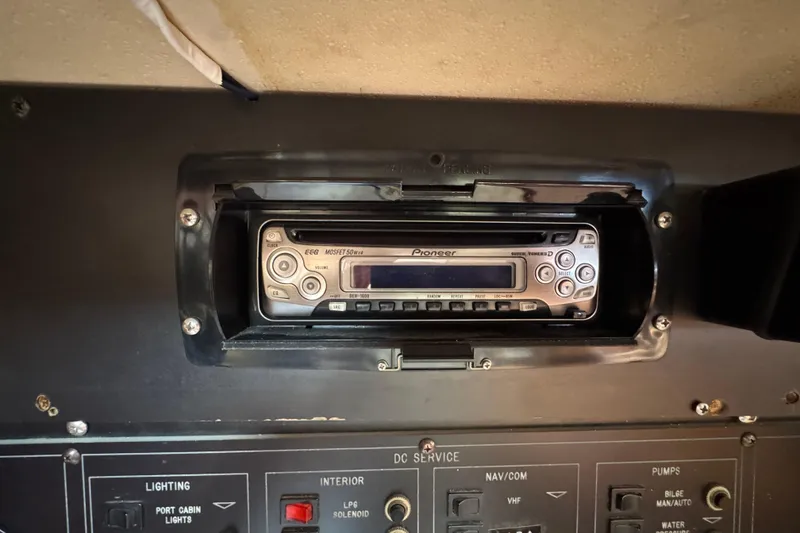 Slide: The Image of Pioneer stereo system in a 1989 Catalina 42 yacht control panel. - 25