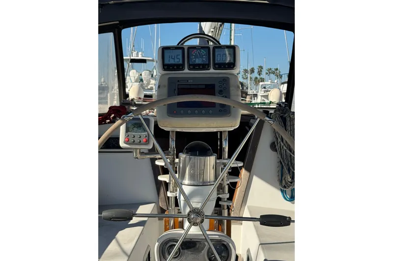 Slide: The Image of Cockpit view of a 1989 Catalina 42 sailboat with navigation instruments. - 4