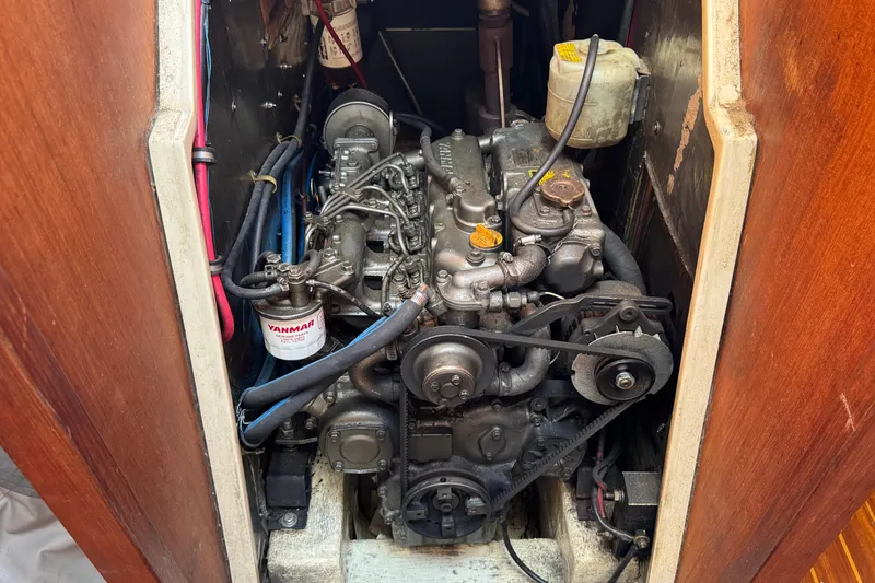 Slide: The Image of Engine compartment of a 1989 Catalina 42 sailboat with Yanmar diesel engine. - 48