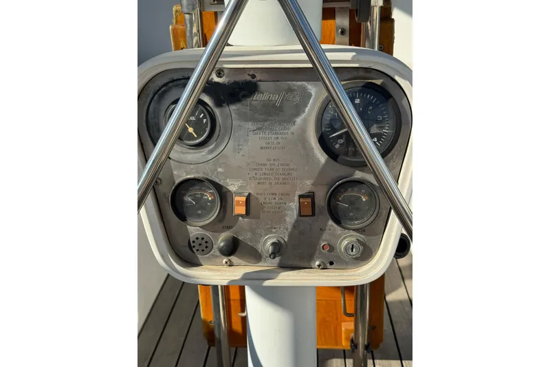 Slide: The Image of Control panel of a 1989 Catalina 42 yacht with gauges and switches. - 5
