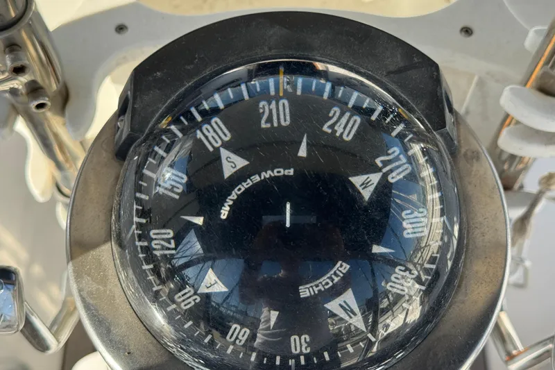Slide: The Image of Compass on a 1989 Catalina 42 sailboat, showing directional headings. - 8