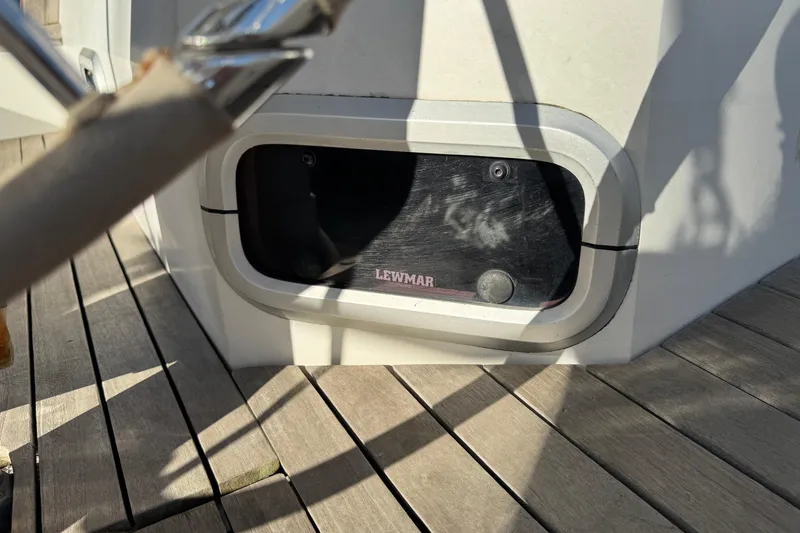 Slide: The Image of Lewmar hatch on 1989 Catalina 42 sailboat deck, sunlight casting shadows. - 9