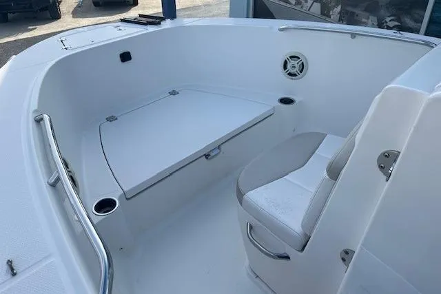 Slide: The Image of 2014 Robalo R180 Center Console boat interior with seating and storage. - 4