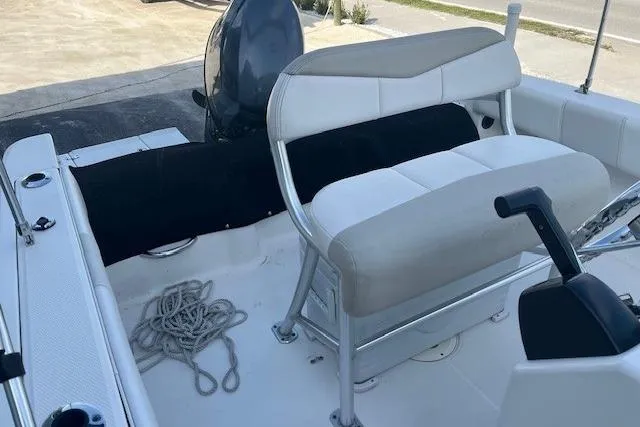 Slide: The Image of 2014 Robalo R180 Center Console boat interior with seating and rope. - 6