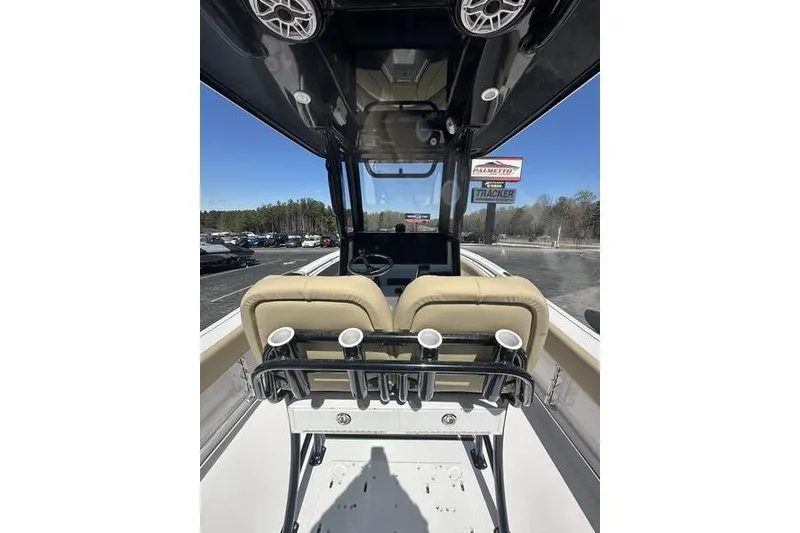 Slide: The Image of 2026 Sportsman Open 232 Center Console boat interior with seating and steering wheel. - 10