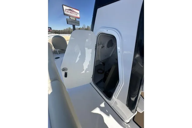Slide: The Image of 2026 Sportsman Open 232 Center Console boat with open storage compartment. - 17