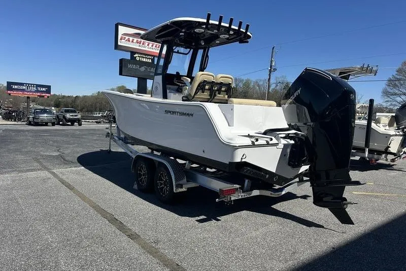 Slide: The Image of 2026 Sportsman Open 232 Center Console boat on trailer in parking lot. - 5