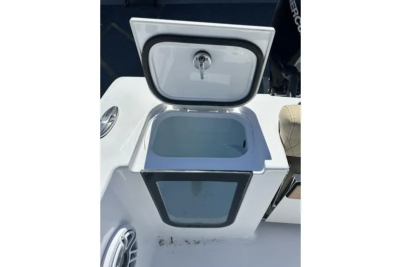 Slide: The Image of Open storage compartment on 2026 Sportsman Open 232 Center Console boat. - 8
