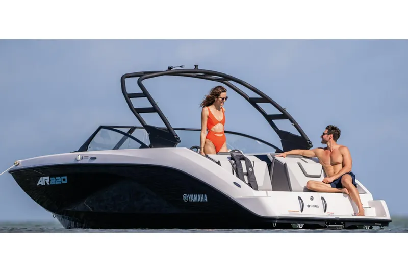 Slide: The Image of 2025 Yamaha Boats AR220 interior with modern seating and sleek dashboard design. - 2