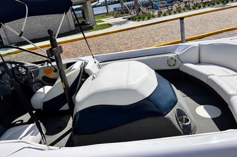 Slide: The Image of 2001 Nautique Air Nautique 210 boat interior with seating and steering wheel. - 10