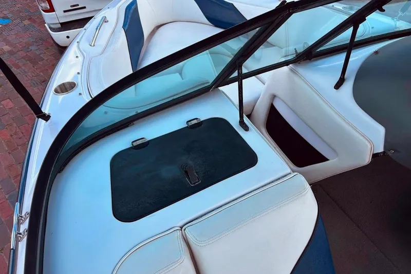 Slide: The Image of 2001 Nautique Air Nautique 210 boat interior with white and blue seating. - 18