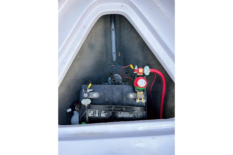 Slide: The Image of Battery compartment of a 2001 Nautique Air Nautique 210 boat. - 21