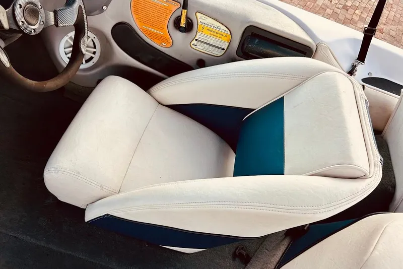 Slide: The Image of 2001 Nautique Air Nautique 210 boat interior with white and blue seating. - 36