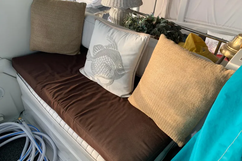 Slide: The Image of Cozy seating area on 1994 Carver 440 Aft Cabin Motor Yacht with decorative pillows. - 10