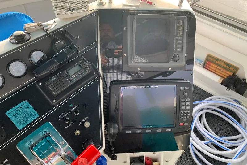 Slide: The Image of Control panel of a 1994 Carver 440 Aft Cabin Motor Yacht with navigation equipment. - 13