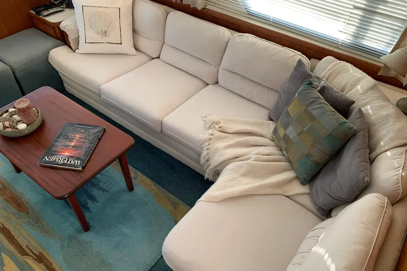 Slide: The Image of Luxurious interior of 1994 Carver 440 Aft Cabin Motor Yacht with cozy seating area. - 15