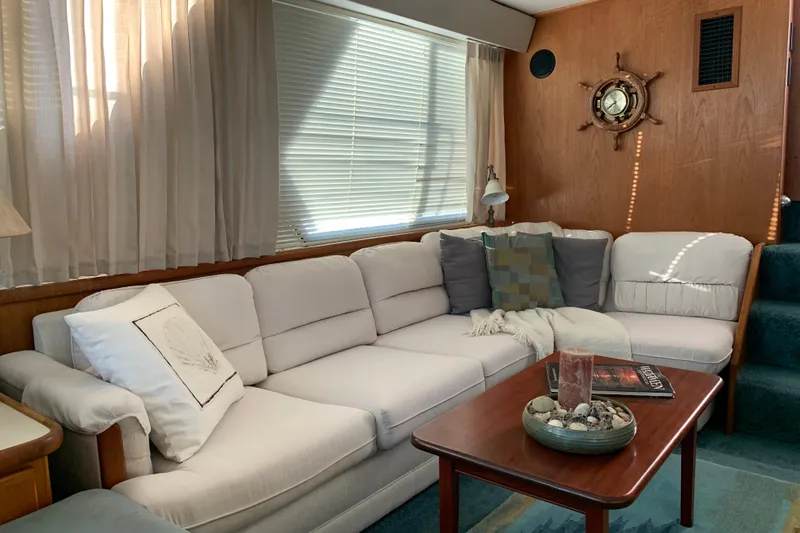 Slide: The Image of Luxurious interior of 1994 Carver 440 Aft Cabin Motor Yacht with cozy seating area. - 17