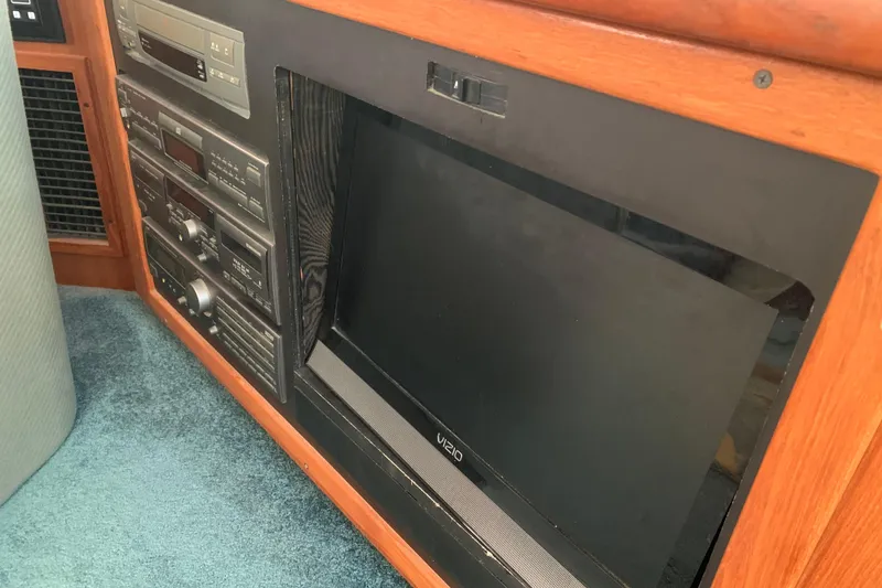 Slide: The Image of Entertainment system in a 1994 Carver 440 Aft Cabin Motor Yacht with Vizio TV. - 19