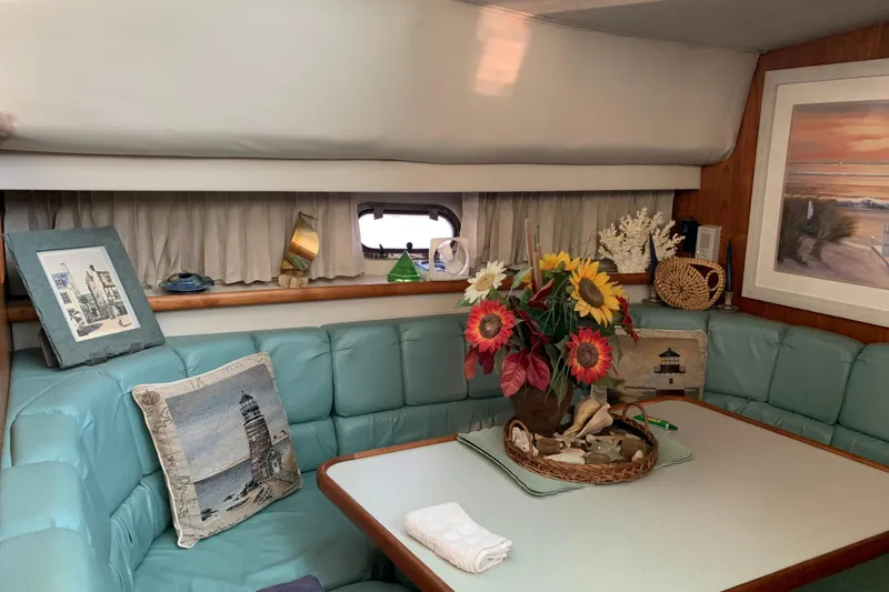 Slide: The Image of Interior of 1994 Carver 440 Aft Cabin Motor Yacht with cozy seating and nautical decor. - 24
