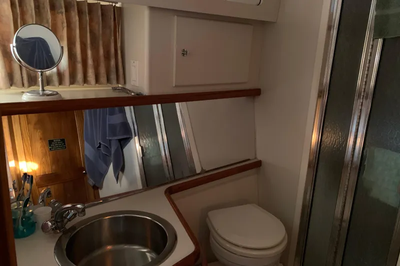 Slide: The Image of Bathroom interior of 1994 Carver 440 Aft Cabin Motor Yacht with sink and shower. - 26
