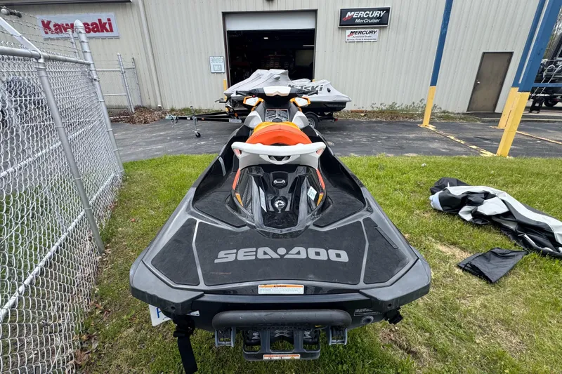 Slide: The Image of 2018 Sea-Doo GTI SE 155 jet ski parked outside a dealership. - 6