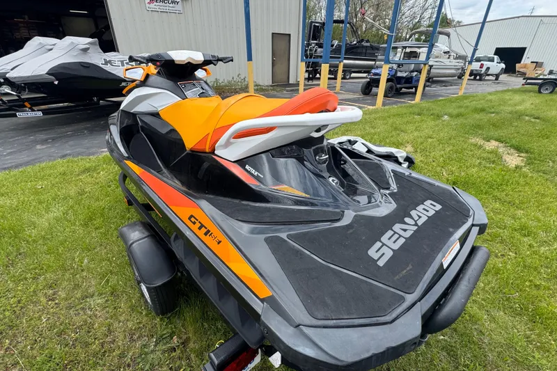 Slide: The Image of 2018 Sea-Doo GTI SE 155 jet ski on trailer, parked outdoors. - 7