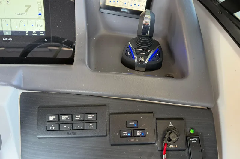 Slide: The Image of Control panel of 2023 Bennington QX 30 QXFBWA X2 Wide Beam with Yamaha controls and Garmin display. - 11