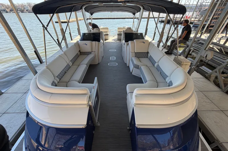 Slide: The Image of 2023 Bennington QX 30 QXFBWA X2 Wide Beam pontoon boat with spacious seating and canopy. - 2