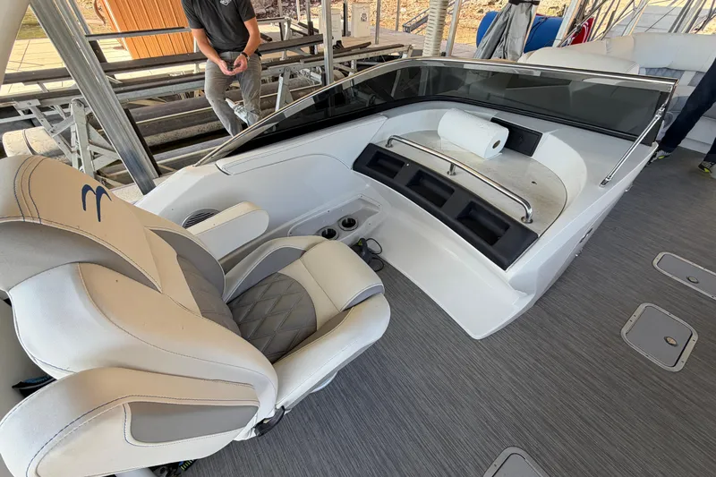 Slide: The Image of 2023 Bennington QX 30 QXFBWA X2 boat interior with helm seat and dashboard. - 23