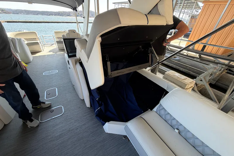 Slide: The Image of 2023 Bennington QX 30 QXFBWA X2 boat interior with open storage compartment. - 34