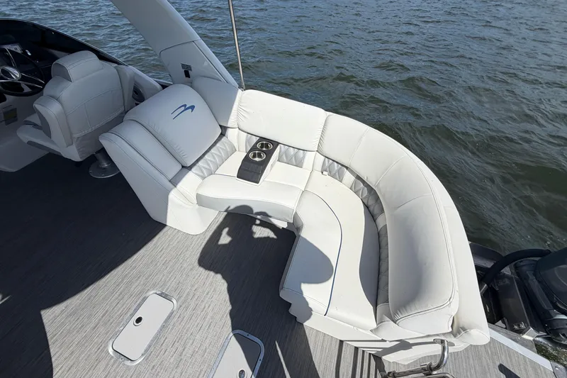 Slide: The Image of Luxurious seating on 2023 Bennington QX 30 QXFBWA X2 Wide Beam boat, overlooking water. - 36