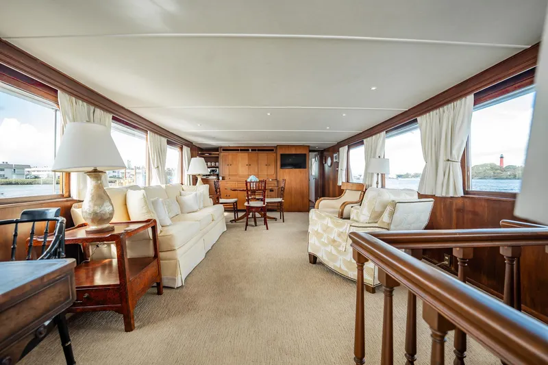 Slide: The Image of Luxurious interior of 1972 Trumpy 72 Motor Yacht with elegant furnishings and panoramic windows. - 14
