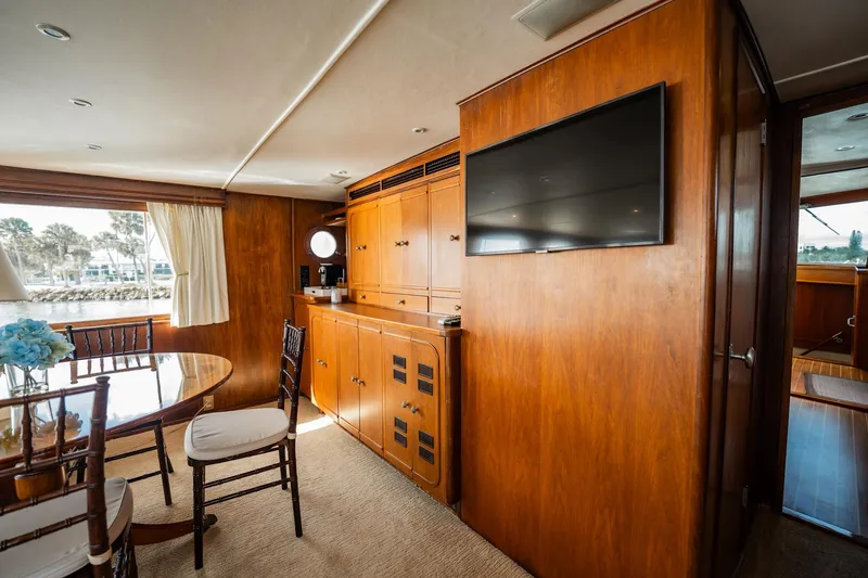 Slide: The Image of Luxurious interior of 1972 Trumpy 72 Motor Yacht with wood paneling and elegant furnishings. - 18