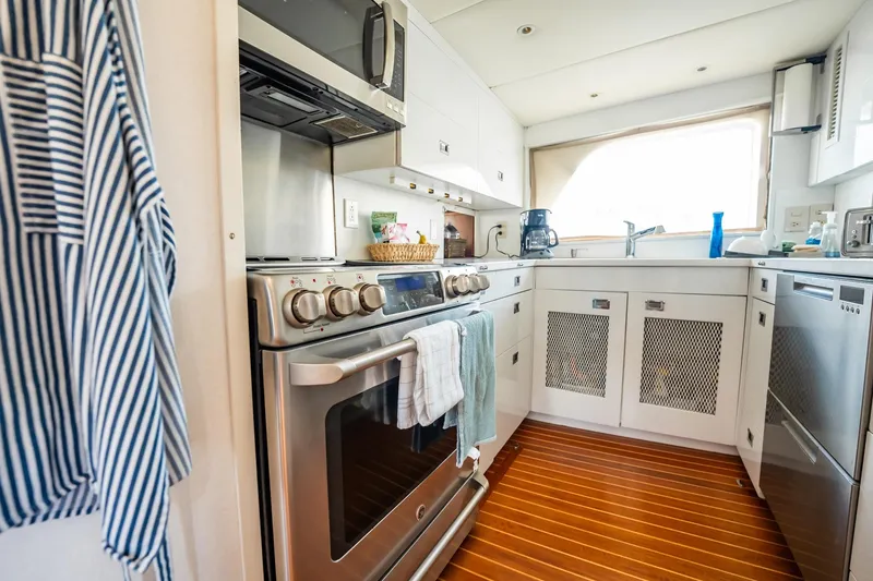 Slide: The Image of Modern kitchen interior on 1972 Trumpy 72 Motor Yacht with stainless steel appliances. - 21