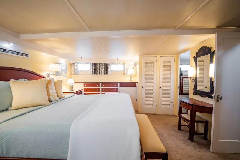 Slide: The Image of Luxurious bedroom interior of 1972 Trumpy 72 Motor Yacht with elegant furnishings. - 31