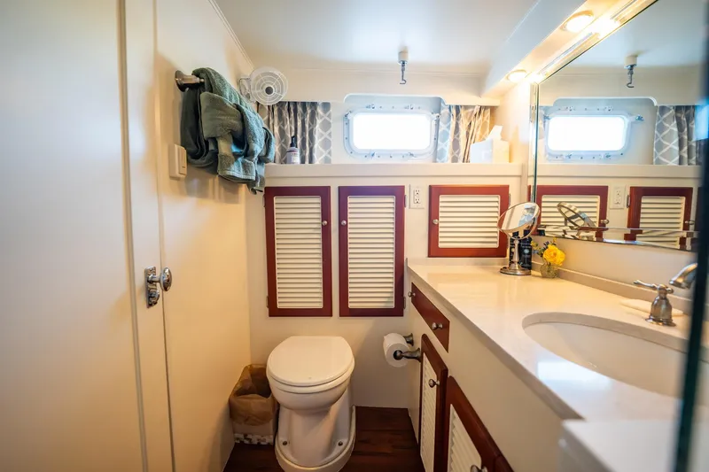 Slide: The Image of Bathroom interior of 1972 Trumpy 72 Motor Yacht with elegant fixtures and wooden accents. - 33