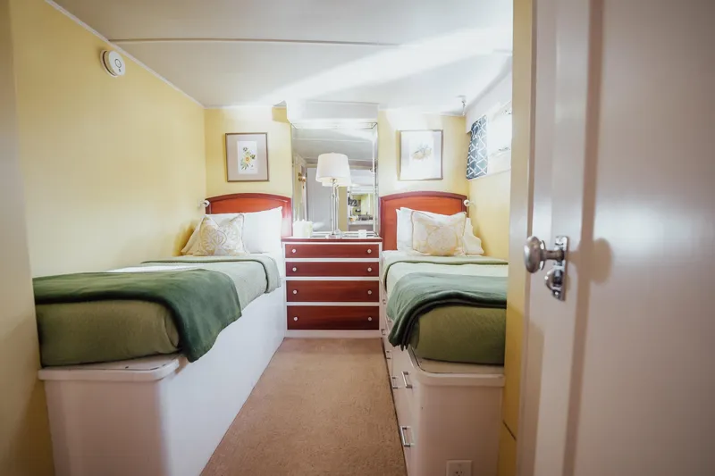 Slide: The Image of Interior of 1972 Trumpy 72 Motor Yacht with twin beds and cozy decor. - 34
