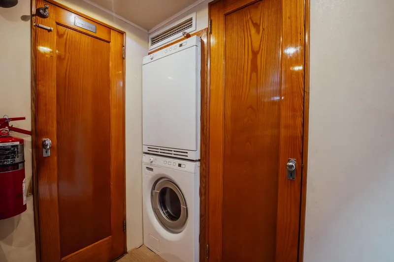 Slide: The Image of Laundry area with stacked washer-dryer in 1972 Trumpy 72 Motor Yacht. - 39